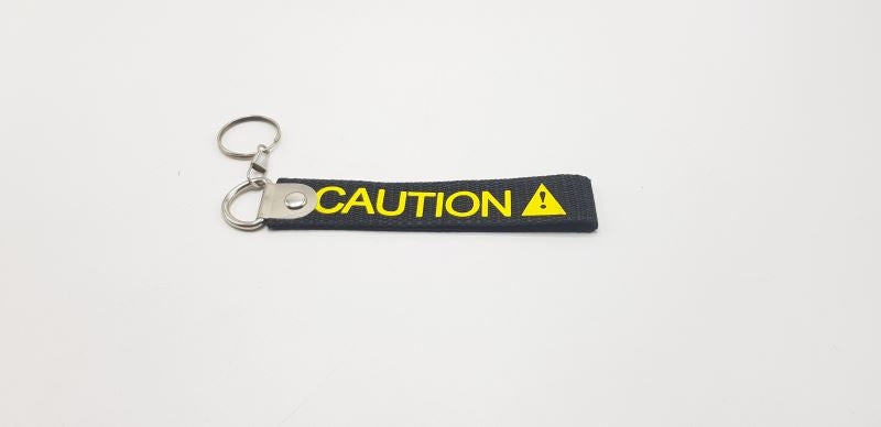 Caution Black Fabric Keychain